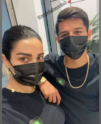 تیپ جنجالی مهدی قائدی و همسر بی حجابش با شلوارک + عکس